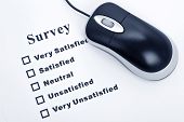 stock photo of survey  - Survey questionnaire and computer mouse business concept - JPG 